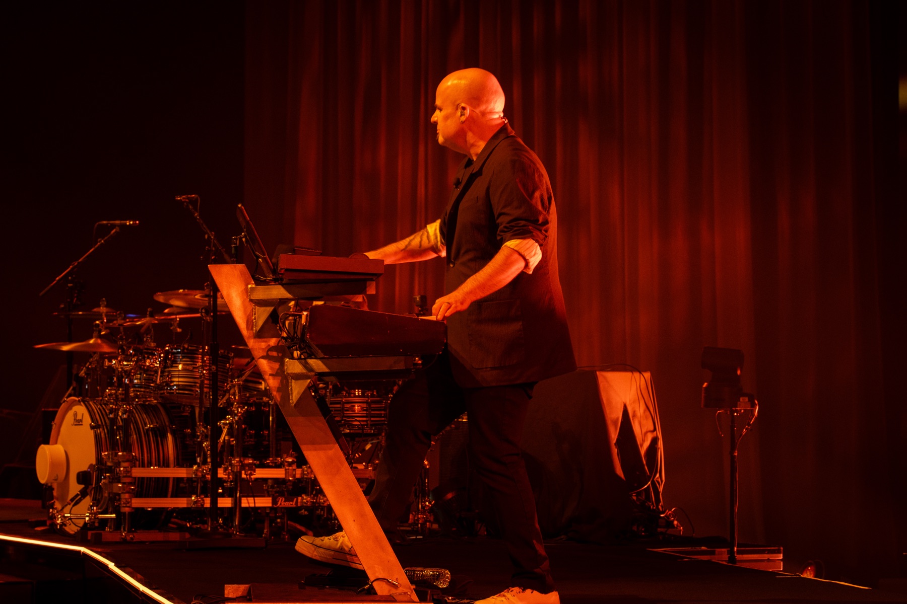 Jason at the keys in red stage light